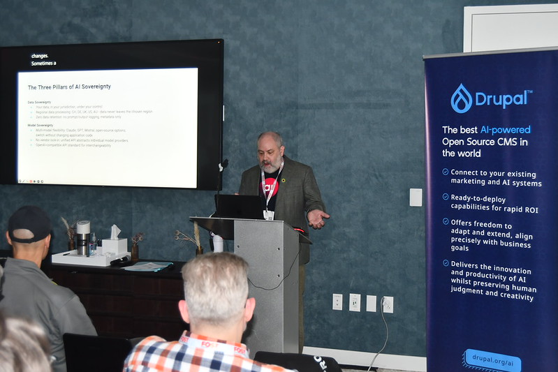 Man standing at a podium talking about AI.