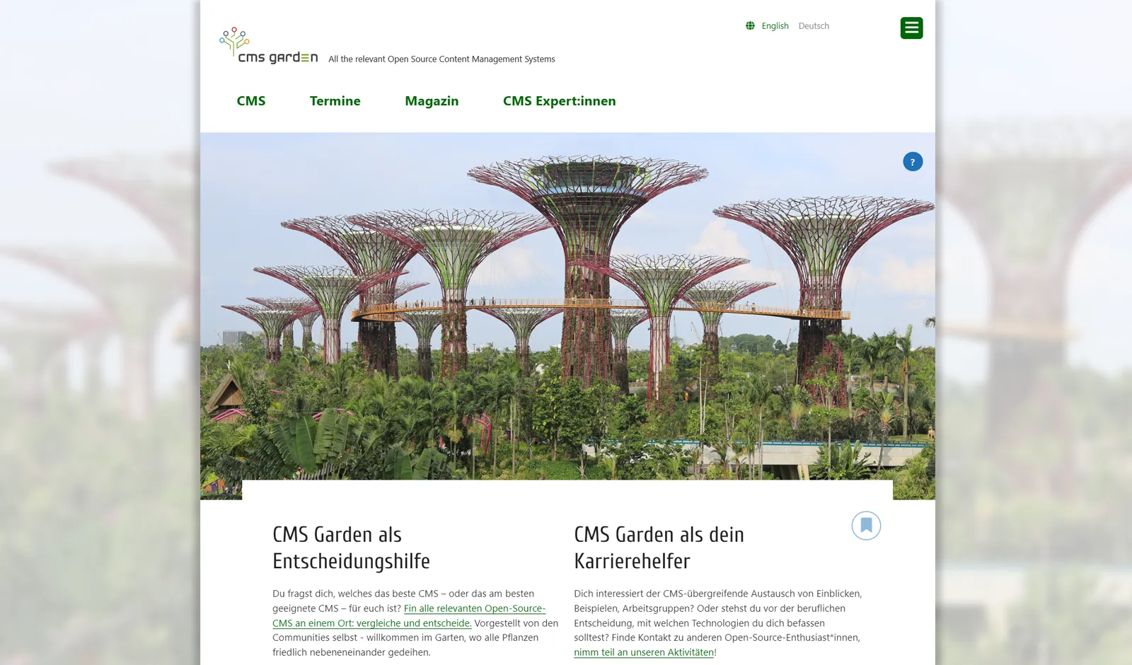 Home page in light mode. The main image shows artificial tree structures in a park