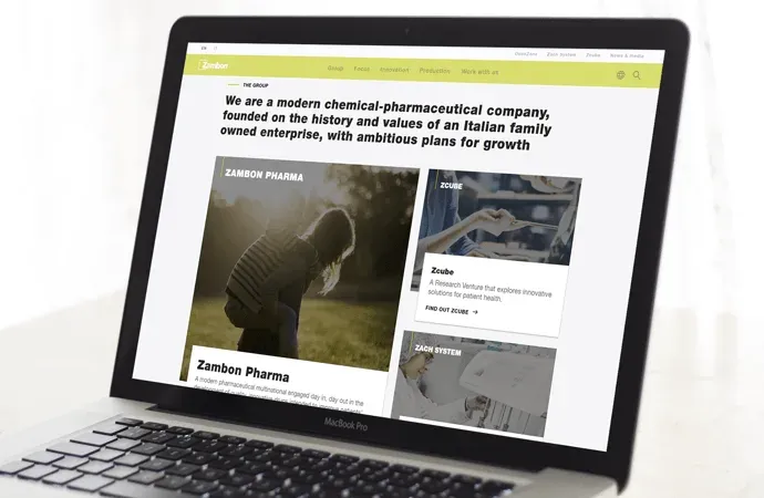 Zambon corporate homepage on a laptop showing the Group, Zcube and Zach System sections