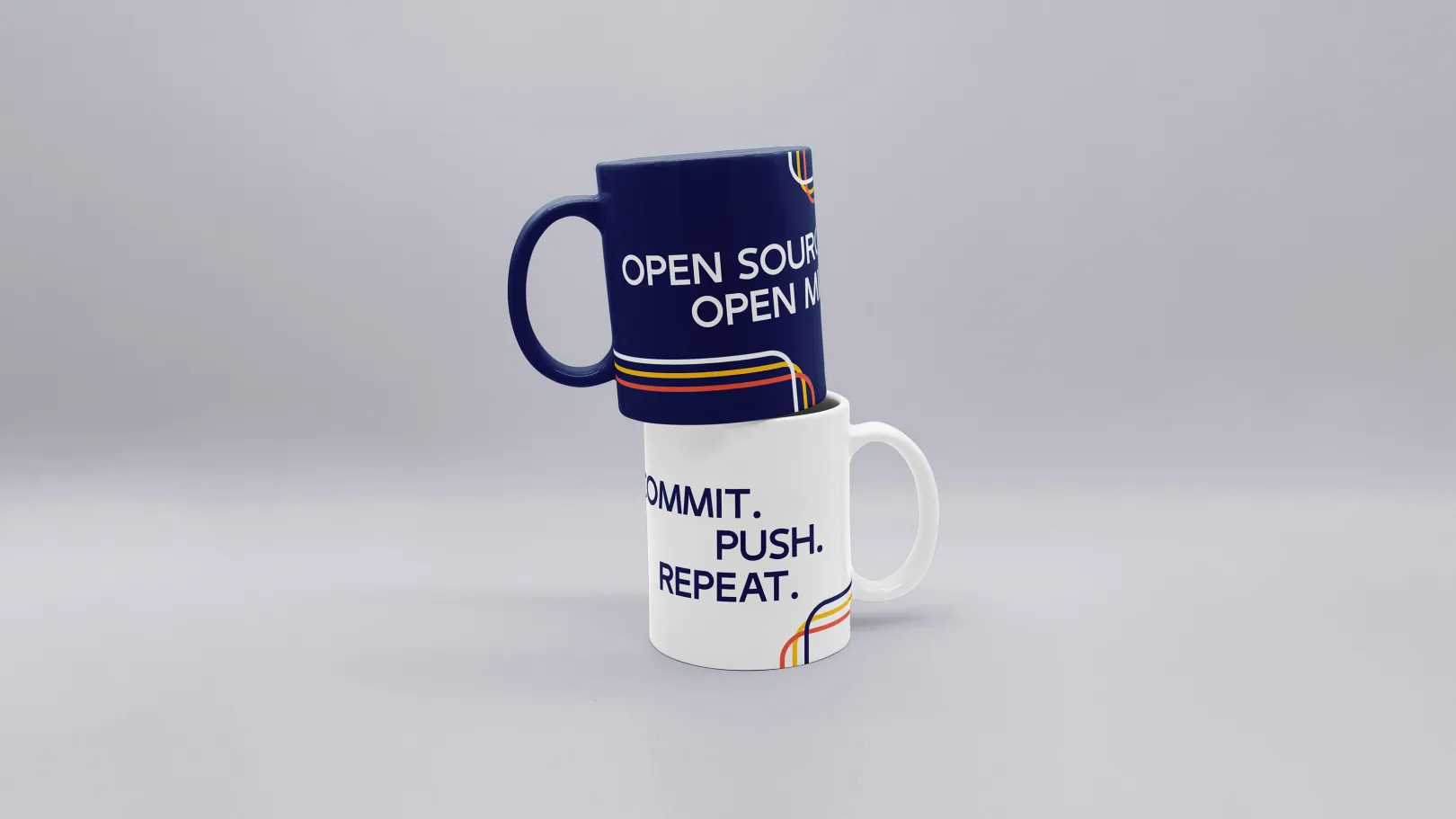 Two coffee mugs with humorous sayings, one dark blue and one white