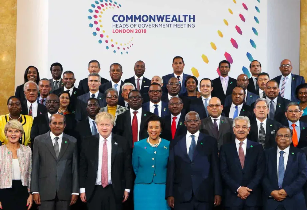 The Commonwealth Secretariat senior staff standing with Boris Johnson