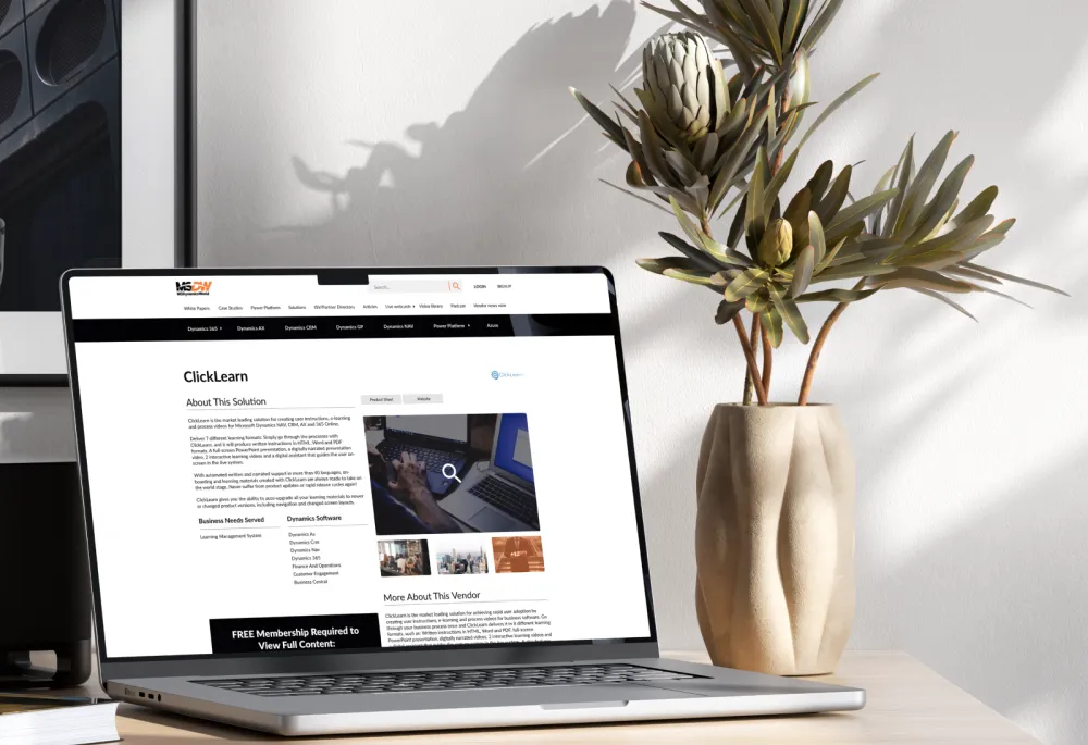 A laptop on a desk with a plant and a picture, showcasing customizable content on the MSDW website.
