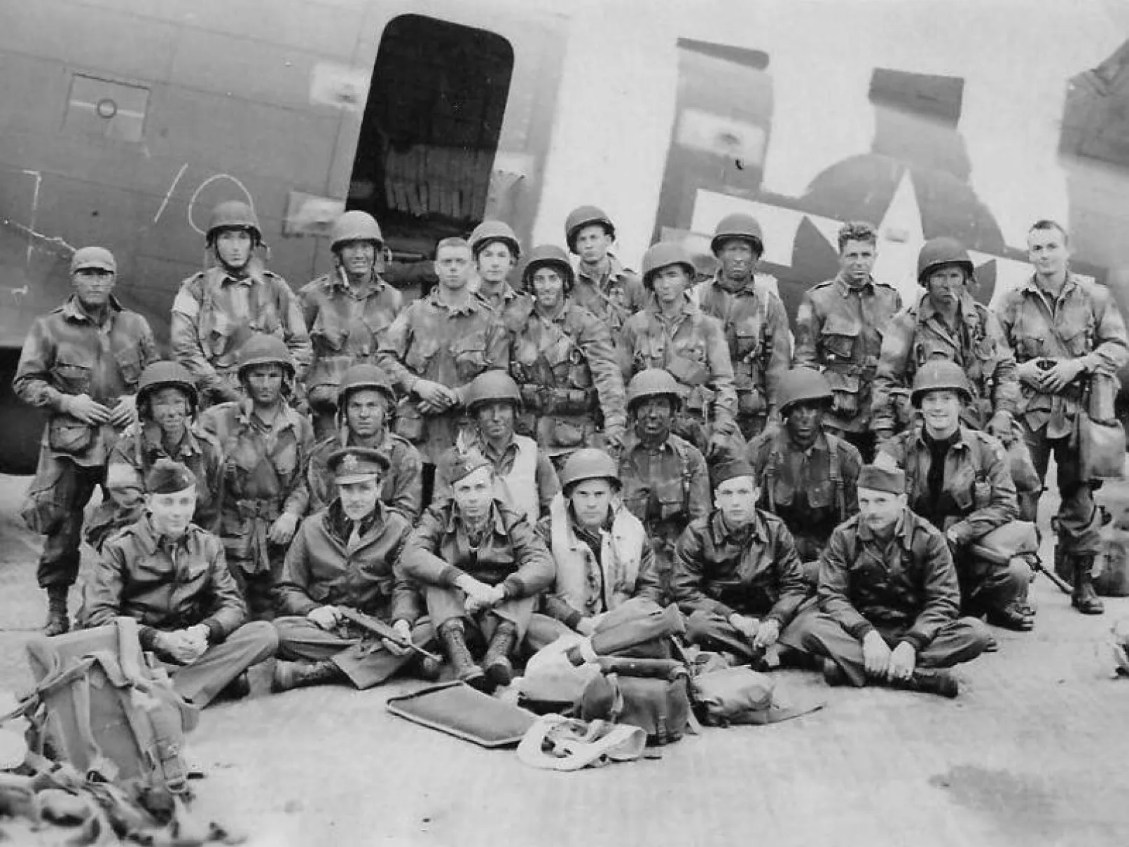 US airborne Pathfinders and aircrew pose beside a C-47 aircraft at North Witham before D-Day